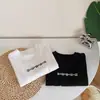 Ropa Unisex para Niños de Primavera y Otoño Camiseta Bebé Elegante Personalidad Infantil Moderna Blanca Algodón Puro Letra Impresión Negra Camiseta Base