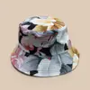 Nueva versión coreana del sombrero de pescador con estampado de flor de hoja para hombre y mujer, protección solar, ocio, viajes al aire libre, sombrero tipo cubo de color, venta al por mayor