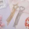 Nuevos pendientes de soldadura con cadena de garra de diamantes de imitación, accesorios de borlas, pendientes versátiles con forma de corazón y estrella redonda de cinco puntas.