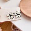 Pendientes de flores con gotas de aceite en blanco y negro, personalidad, temperamento, todo a juego, pendientes de alta gama para niñas, pendientes de nicho, clip para la oreja de mujer
