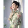 La popular camisa de gasa floral de temperamento verde de este año para mujer 2025 verano nueva de alta gama sensación de lujo ligero camisa rejuvenecedora