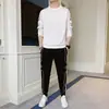 Traje de hombre primavera 2024 nuevo conjunto de suéter de cuello redondo con leggings deportivos casuales traje guapo