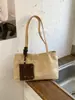 Bolso de mano nuevo para mujer, gran capacidad, versátil para el uso diario, de alta gama, adecuado para ir al trabajo, hecho de gamuza, bolso de hombro, bolso tote, diseño de nicho