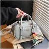 Bolsa de Boliche Portátil Texturizada Estilo Coreano para Mulheres Nova Coleção Primavera 2025 Estilo Coreano Nicho Bolsa Boston Bolsa Transversal Estilo Ocidental