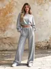 Conjunto de sudadera casual de moda de alta gama de color liso, manga corta y larga, y pantalones anchos elásticos, nuevo para otoño e invierno 2026 en Europa y América