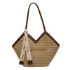 Bolso de paja de gran capacidad, nuevo modelo de verano 2026, bolso de hombro de nicho para mujer para vacaciones en la playa, bolsa de playa tejida tipo tote
