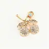 Broche de trébol de cuatro hojas de lujo con diamantes, pequeño pasador de aleación para trajes de mujer, chaquetas, cárdigans y decoraciones de cuello