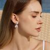 Nuevos aretes de cristal de cola de pez 2024 aretes de temperamento para vacaciones de verano aretes de nicho de diseño único viento frío
