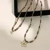 Collar Colgante de Flor con Cuentas de Piedra Ojo de Tigre Melard para Mujer 2026 Nuevo Diseño Nicho Colgante Largo Collar para Suéter