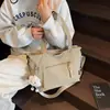 Bolso de hombro ligero, bolso de lona para commuting para mujer, nuevo bolso escolar de gran capacidad para estudiante universitario, bolso de mano al por mayor