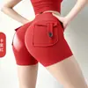Nuevos shorts de yoga estilo ropa de trabajo transfronteriza con diseño de trasero en forma de durazno, cintura alta, tela elástica, efecto levanta glúteos, cierre de botón y material de secado rápido; hecho a medida