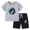 Camiseta Infantil 2026 Tiktok Verano Nuevo Comercio Exterior Ropa Infantil Estilo Coreano Conjunto de Dos Piezas de Manga Corta y Pantalones Cortos para Niños