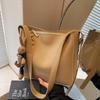 Bolso casual sencillo y popular para mujer, bolso de hombro retro combinable, bolso bandolera tipo cubo de alta gama, estilo crossbody, 2025