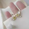 Accesorios metálicos para decoración de uñas de ojo de gato mariposa de circonita, decoración de uñas de aleación de rhinestone tridimensional súper brillante, colores oro y plata con goteo de aceite
