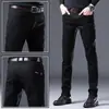 Jeans gruesos de invierno de alta gama de Hong Kong con forro polar para hombre, pantalones versátiles elásticos de corte recto para hombre, pantalones casuales de negocios para hombre