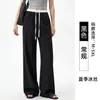 Pantalones de traje personalizados para hombre alto talla extra, de seda de hielo, contraste blanco y negro, corte estrecho, diseño transfronterizo y patronaje de fábrica de ropa de muestra