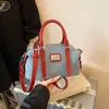 Bolsa de mão de ganga color block transfronteiriça para mulheres, nova bolsa Boston tipo almofada crossbody da moda estilo coreano 2026