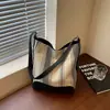 Bolsa de mano retro a rayas para mujer, nuevo modelo 2026, estilo casual, bolso tipo cubo de gran capacidad, adecuado para el trabajo y los desplazamientos, bolso cruzado
