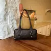 Bolso de axila retro de nicho para mujer, nuevo bolso de hombro de moda 2026 para ir al trabajo, bolso de mano versátil y elegante al por mayor