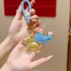 Llavero Dorado con Acabado de Alta Gama, Colgante del Año del Caballo, Oro Puro, Riqueza Instantánea, Adorno para Bolso, Regalo de Año Nuevo