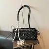 Bolsa de ombro estilo baguette Shuai Mi Jia nicho e estilosa para mulheres, nova moda 2026 com laço, bolsa de ombro