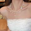 Nuevo estilo, collar ligero de lujo con flecos de loto y perlas de verano para mujer, exquisito, elegante, de alta gama, cadena de clavícula que combina con todo.