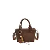 Otoño 2026 Bolso Cubo Tejido de Alto Valor Nuevo para Mujer de Moda Tendencia Elegante Bolso de Hombro Único Cruzado Bolso Pequeño Texturizado