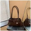 Bolso tipo baguette de un solo hombro con diseño de nicho estilo coreano y decoración de cinturón, nuevo y moderno bolso para el antebrazo, bolso de mano y bolso cruzado versátil para mujer