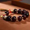 Pulsera Vintage de Agata Color Borgoña Oscuro Estilo Tíbet con Calavera Tallada en Hueso y Cuentas Facetadas de Ágata Roja, Coleccionable Vintage