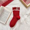 [7A antibacteriano] Calcetines de algodón rojo festivos de Año Nuevo calcetines de tubo sin costuras antibacterianos de ramio este año calcetines de algodón transpirables para mujer