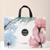 Loja de Roupas Femininas da Moda Camélia Bolsa Tote Não Tecida Publicidade Ecológica Em Estoque Bolsa de Compras Atacado de Roupas