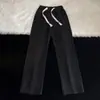 Pantalones vaqueros rectos retro de estilo americano para hombre, pantalones casuales holgados de primavera y otoño con cintura holgada y cordón ajustable con un diseño de nicho.