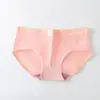 Calcinha feminina lisa de cintura média, forro de algodão respirável, sem costura e confortável, disponível em várias cores para meninas jovens