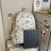 Mochila escolar para estudiantes de secundaria femeninas, mochila decorativa con adornos de encaje para niñas, bolsa ligera casual de doble hombro, protectora de la columna vertebral y reductora de carga
