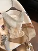 Chaleco de Punto Sin Mangas con Cuello en V Hueco de Avena Falso Dos Piezas para Mujer Verano 2026 Nuevo Estilo Old Money Temperamento Top Adelgazante