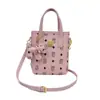 Bolso de mujer transfronterizo 2026 nuevo diseño de nicho pequeño bolso de mano bolsa para teléfono de osito de dibujos animados sensación de alta gama bolso cubo lindo