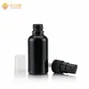 Botella de vidrio negro oscuro con bomba de presión, cabeza de goma dispensadora de emulsión, tapón de rosca gotero, botella redonda negra para aceite