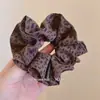 Goma de pelo Vintage Grande Estampado de Leopardo Estilo Coreano Moderna Alta Calidad Elegante Cola de Caballo Baja Alta Elasticidad Versátil Goma para el Cabello