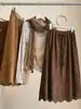 Saia Meia-Calça Feminina de Camurça Plush Vazada Estilo Retro Maillard Outono Inicial Novo Estilo Temperamento Emagrecedora de Idade Comprimento Médio Linha A