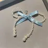 Zapatos de ballet del mismo estilo de Jennie con cadena de lazo de perla en forma de corazón plateado hebilla de zapato con letra DIY cierre de flor