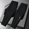 Calças masculinas para primavera e outono, calças casuais da moda com bolsos com zíper, calças esportivas jogger retas largas