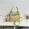 Bolso Cubo de Mano de Nicho Estilo Coreano para Mujer 2026 Primavera Nuevo Moda Bolso de Hombro Único Bolso Cruzado Simple de Alto Valor