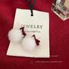 Pendientes de peluche con lazo de terciopelo rojo para mujer, pendientes de bola de pelo con atmósfera de Año Nuevo, pendientes de otoño e invierno de alta calidad que combinan con todo.