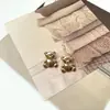 Oso de dibujos animados lindo dorado claro pierna alta botón de metal abrigo de tweed cárdigan suéter top hebilla decorativa