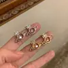 Nuevos Pendientes de Saturno Huecos con Circonitas Cortadas Chapados en Oro Elegantes y Simples Estilo Ins con Cierre de Plata Pendientes de Planeta Elegantes para Mujer