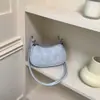 Bolsa pequena de textura de alta qualidade feminina 2026 novo estilo moderna versátil bolsa transversal requintada super quente bolsa quadrada pequena de ombro único axila