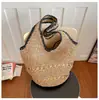 Bolsa de playa tejida casual de verano para mujer, bolsa de hombro versátil para el día a día estilo Hepburn de alta gama