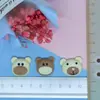 Serie de cabeza de oso accesorios de resina DIY clip de pegamento de crema accesorios accesorios de resina al por mayor parche para funda de teléfono móvil