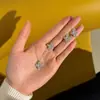 Juego de Collar de Trébol de Cuatro Hojas Tridimensional Electrochapado con Oro Real de 14K en Plata de Ley S925, Lujo Ligero Transfronterizo Completamente Incrustado con un Sentido de Elegancia