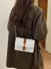 Otoño 2026 Nuevo Bolso Cuadrado Pequeño de Bloques de Color Sencillo Bolso de Mano para Mujer Bolso de Hombro Versátil Bolso para Ir al Trabajo y Citas Bolsos de Mujer al por Mayor